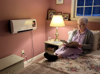 Reading in bed with Power Heat Pro on the far wall