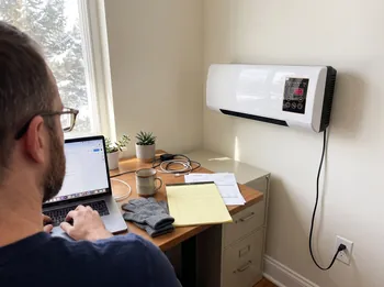 Working bare-handed at the desk with gloves off and Power Heat Pro on the wall
